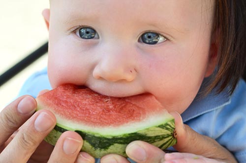 Kellan eating watermelon